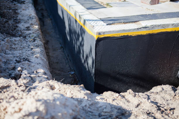 Professional Emergency Waterproofing technician working in Fremont, MI